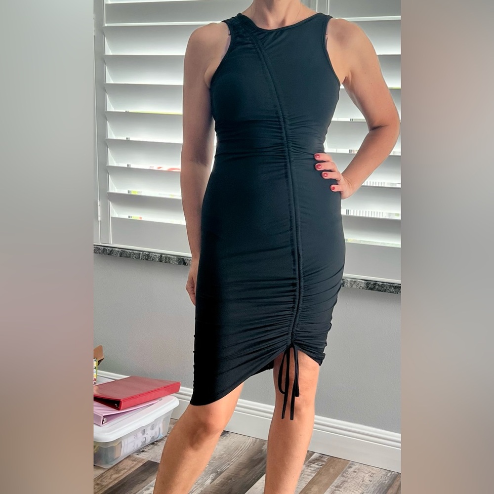 Black dress with the zipper in the back. Fits size S